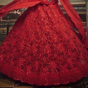Red net sequin work and dori embroidered lehenga choli with net dupatta